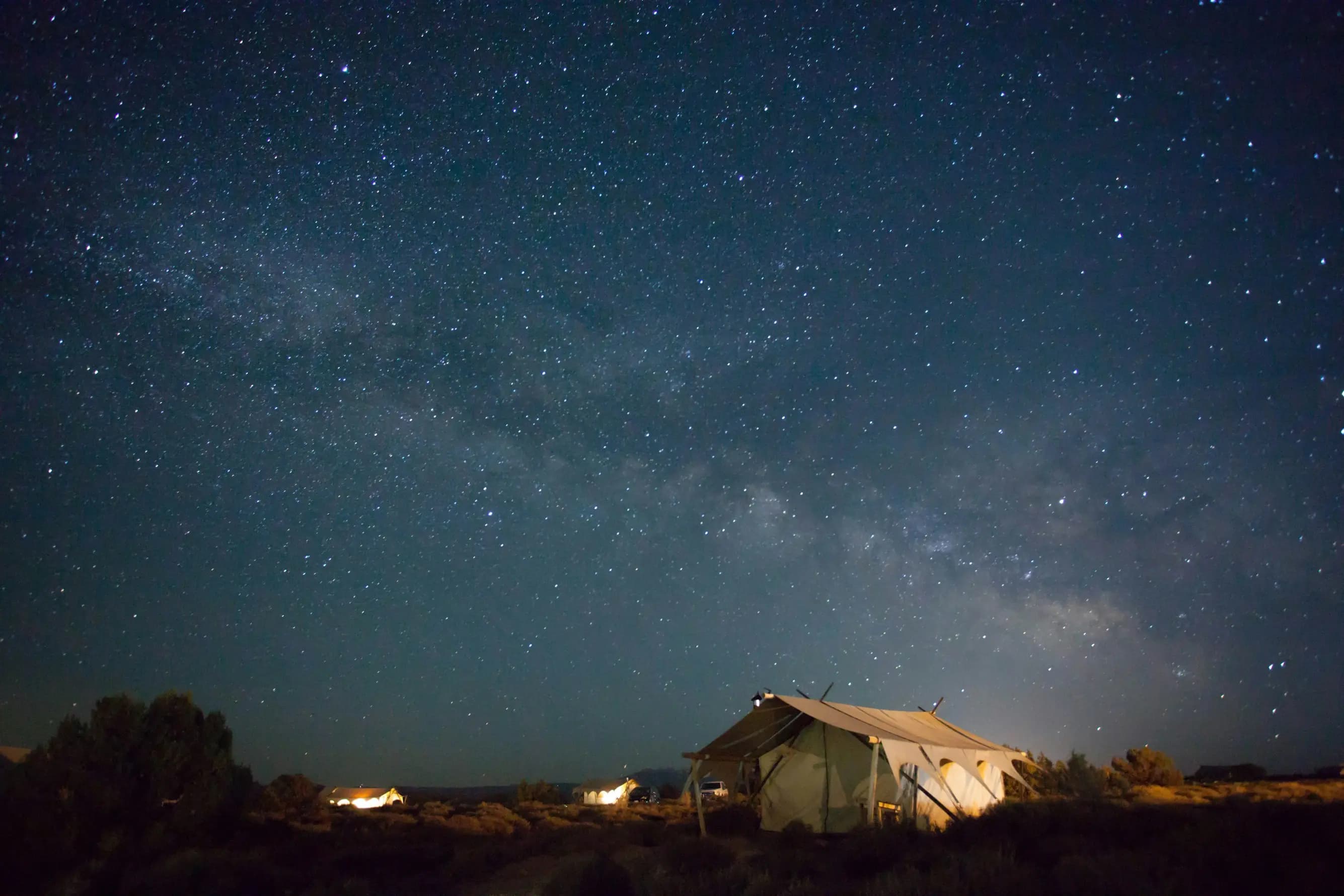 Desert night camp under starry sky
